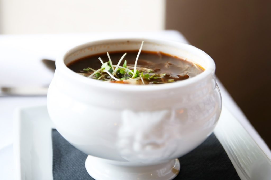 The Governor's Classic French Onion Soup starter at Marco Pierre White Steakhouse Double Tree by Hilton Cambridge